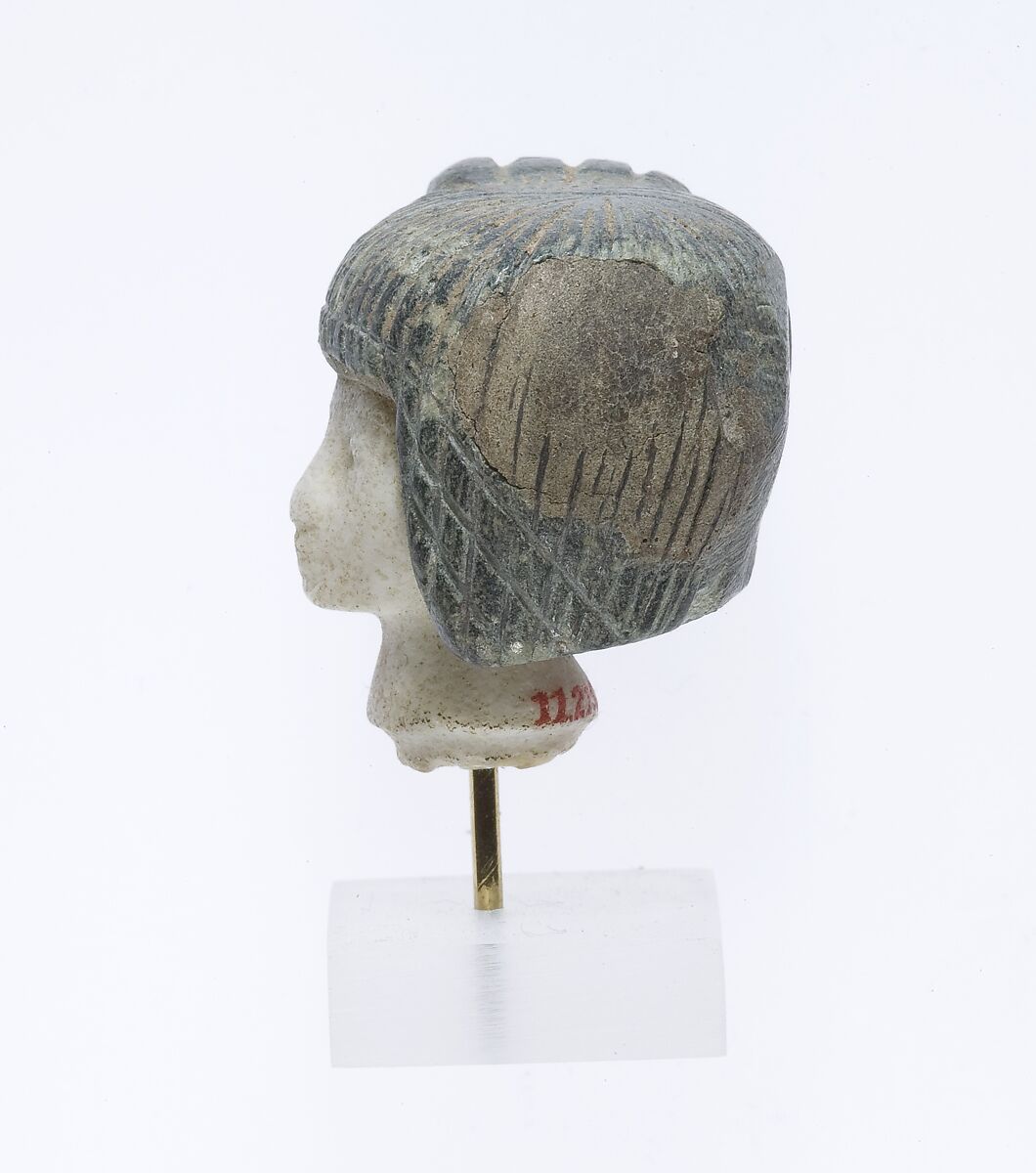 Head from a Spoon in the form of a Swimming Girl, Travertine (Egyptian alabaster), steatite