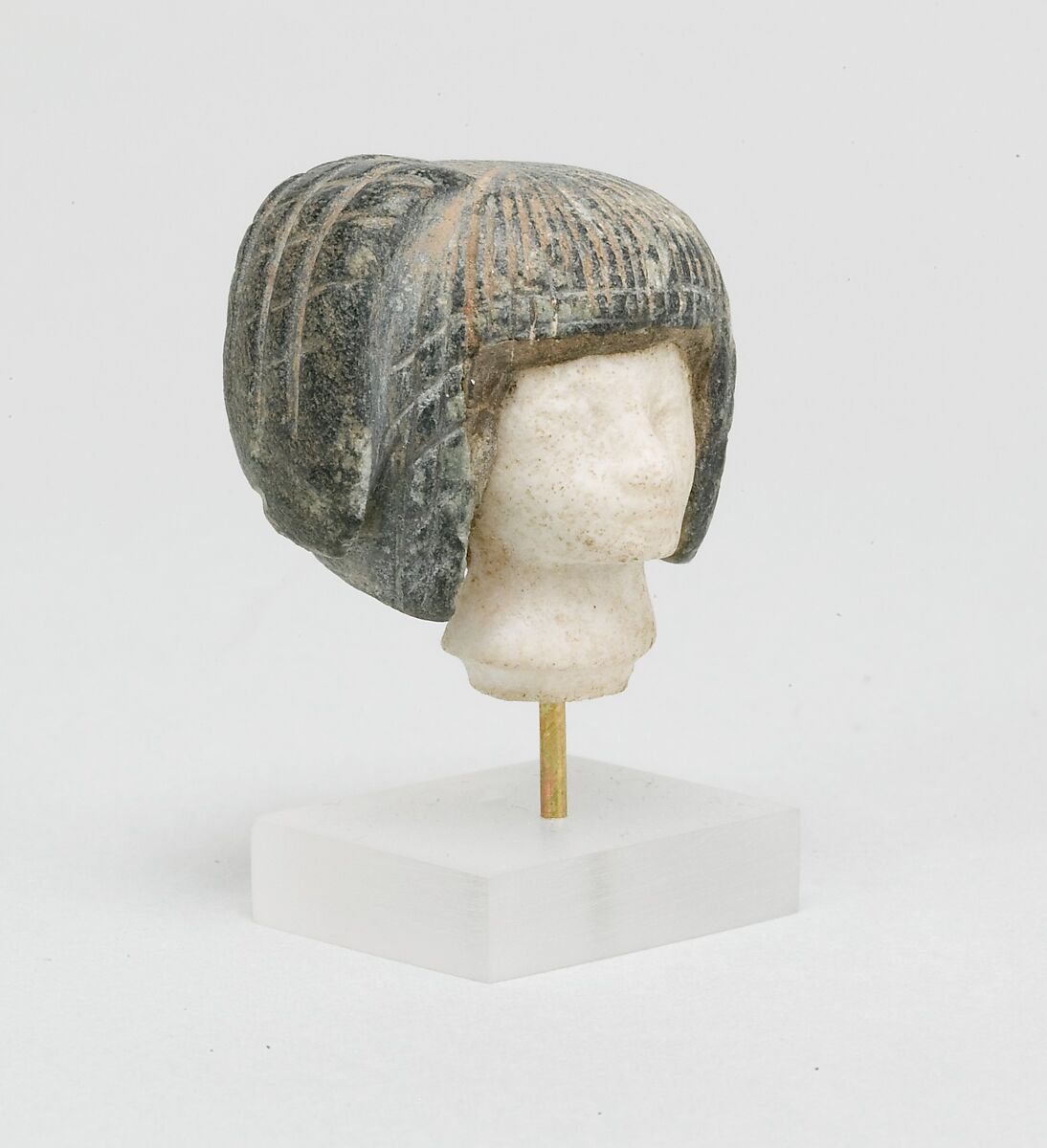 Head from a Spoon in the form of a Swimming Girl, Travertine (Egyptian alabaster), steatite