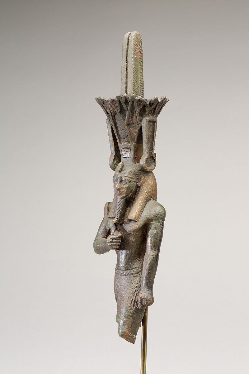 Nefertum, cupreous metal, black bronze and precious metal inlay, glass