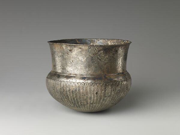 Bowl with flutes from shoulder to rosette at base and with inscribed weight