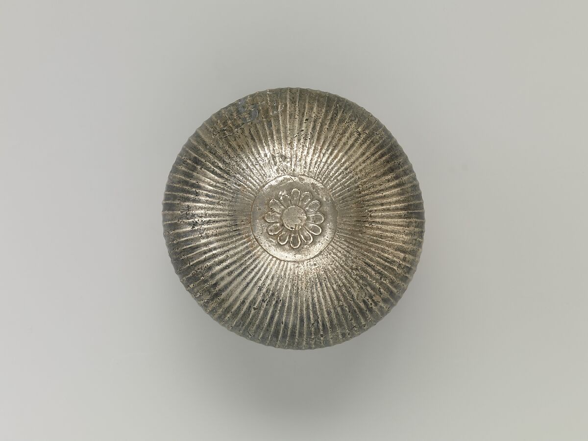 Bowl with flutes f rom shoulder to rosette at base, silver