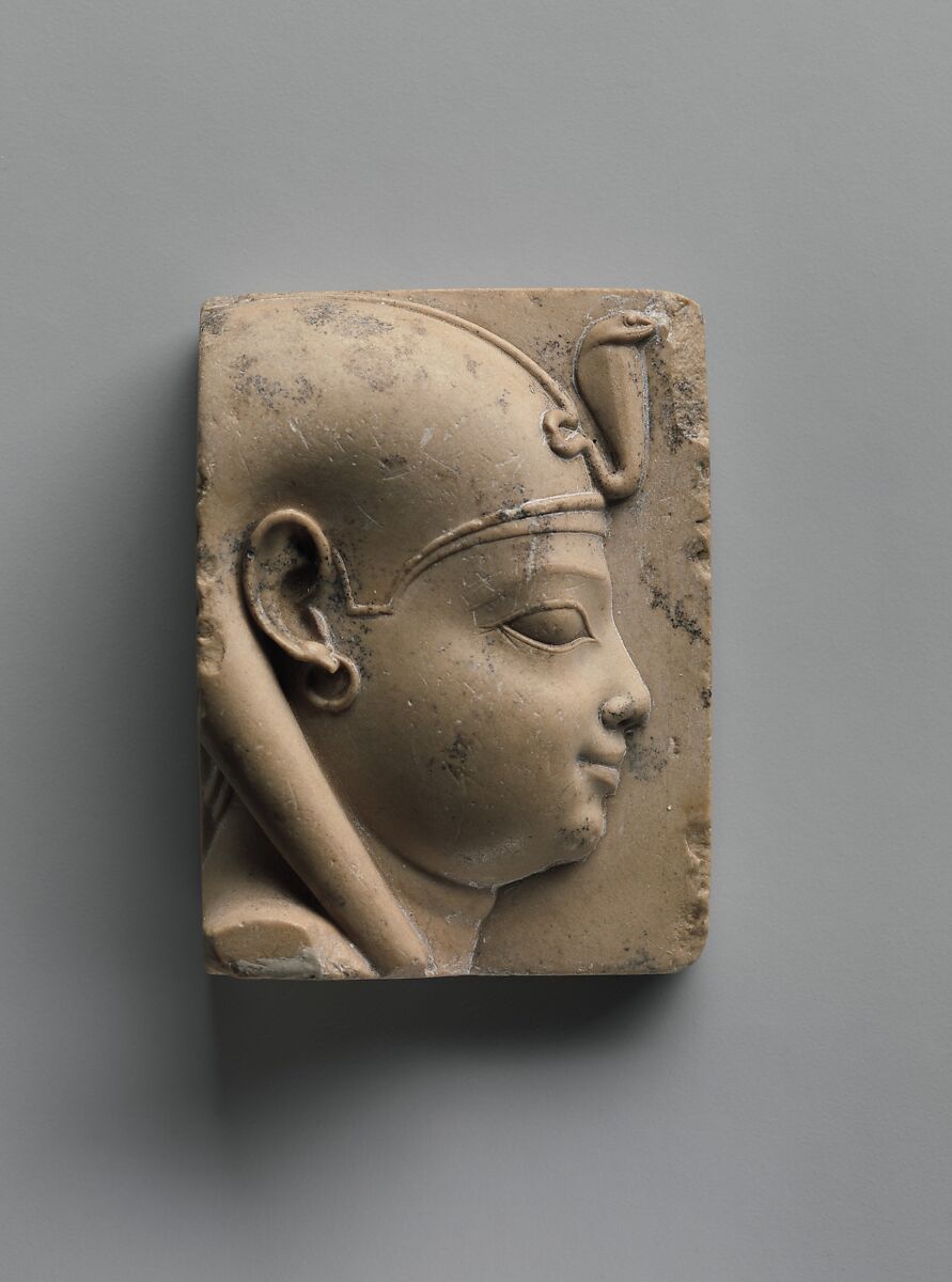 Plaque with bust of a divine child with earring (Ihy?), Limestone 