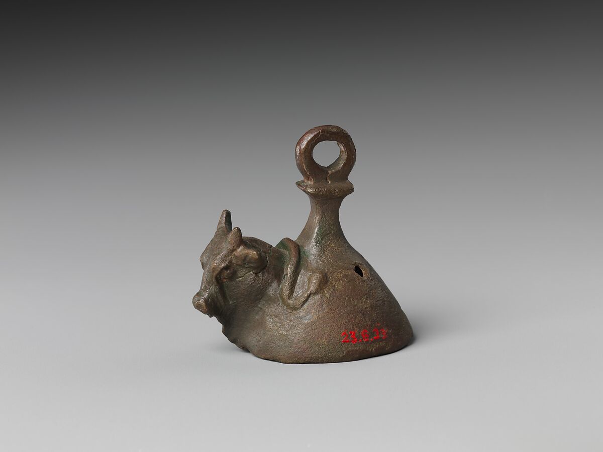 Bell with head of a bovine wearing a yoke ending in uraei, Leaded bronze