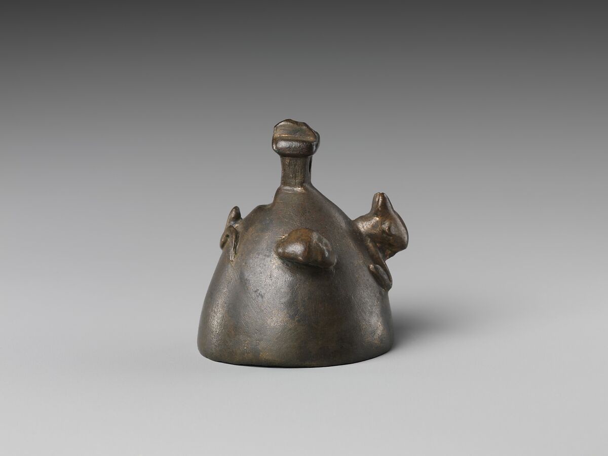 Bell with heads of a ram, a jackal, and a bovine wearing a yoke ending in uraei, Leaded bronze