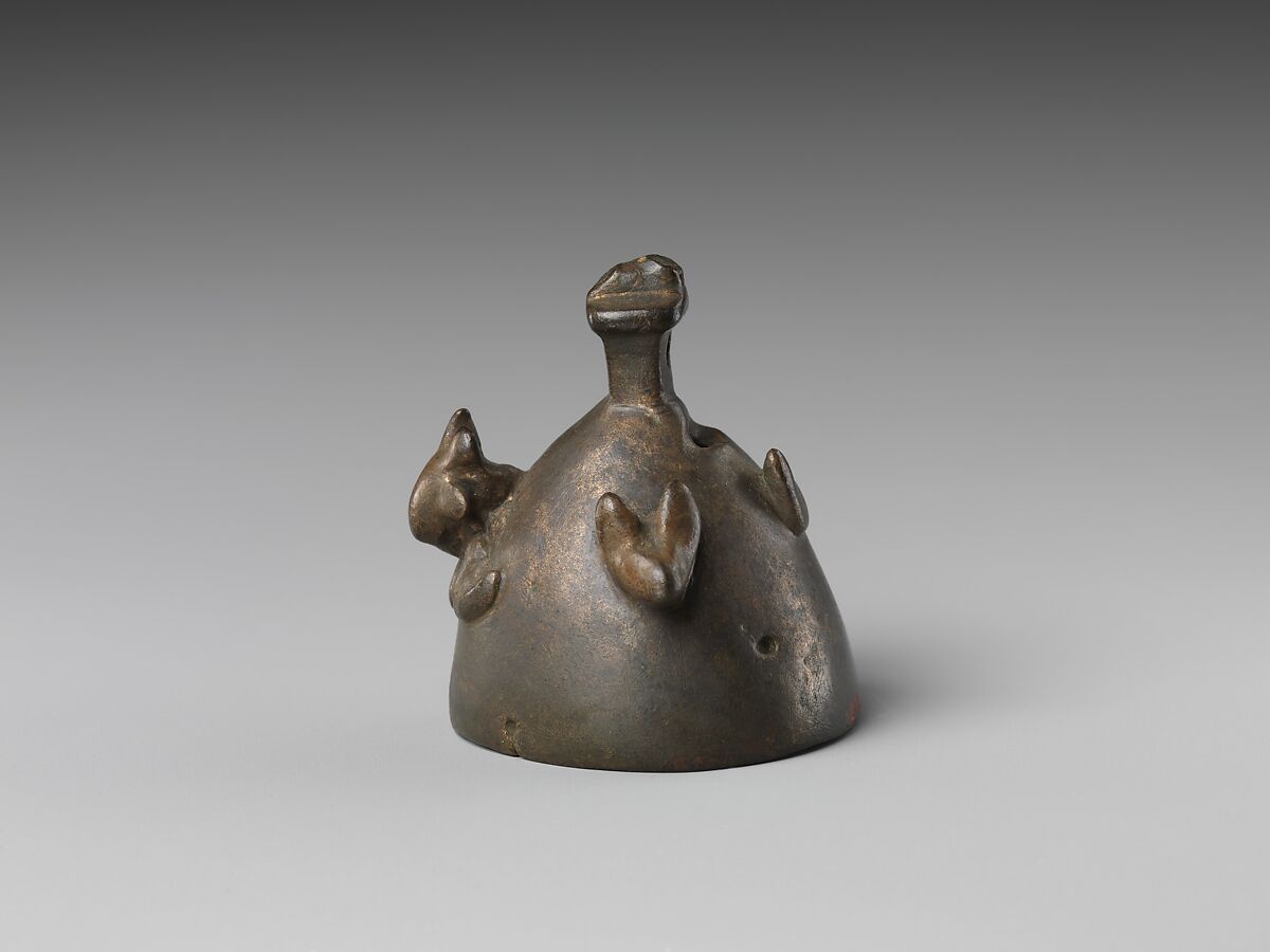 Bell with heads of a ram, a jackal, and a bovine wearing a yoke ending in uraei, Leaded bronze