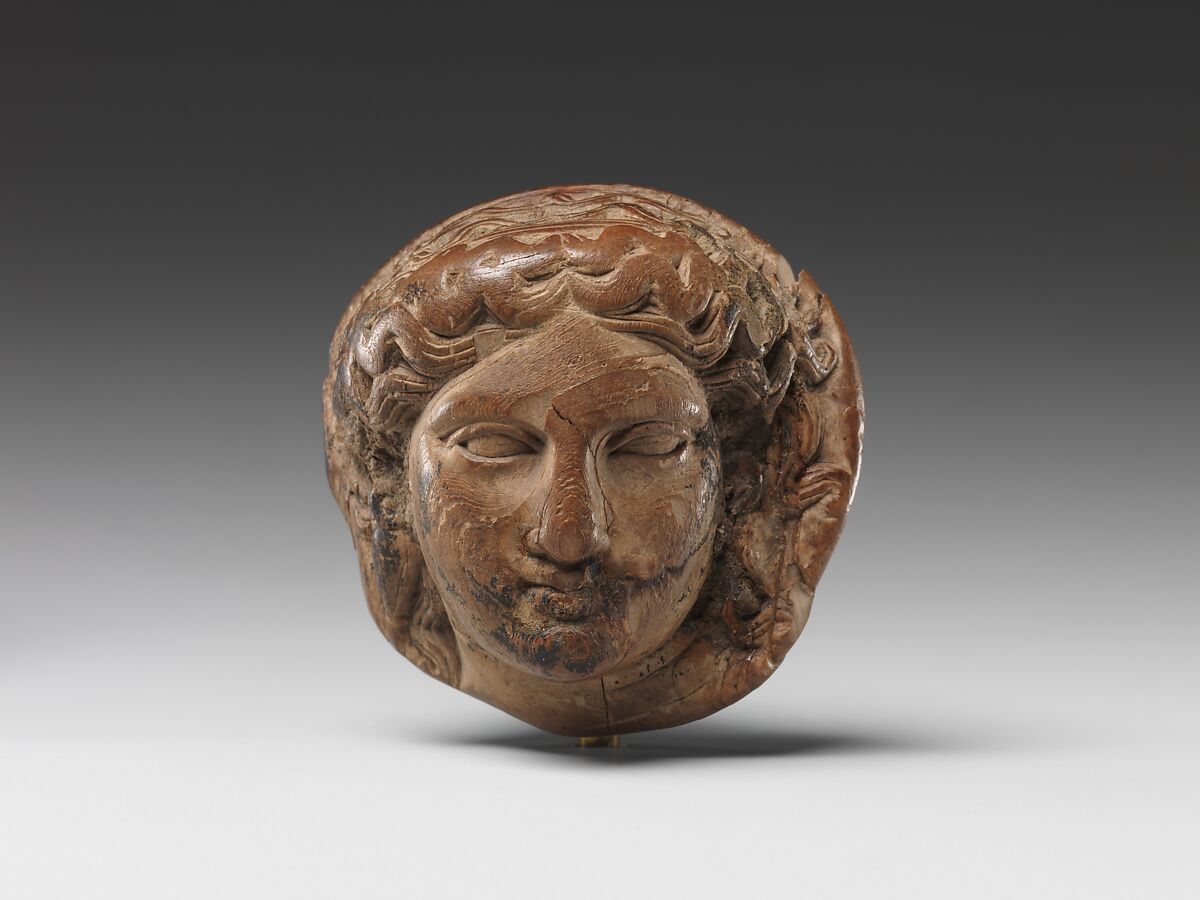 Head of Dionysus (?) for attachment, possibly for a couch, ivory 
