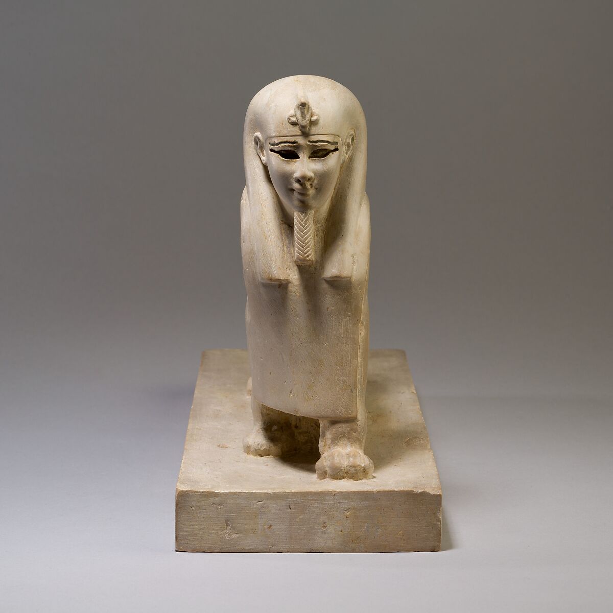 Tutu, limestone, pigment inlay; missing inlay