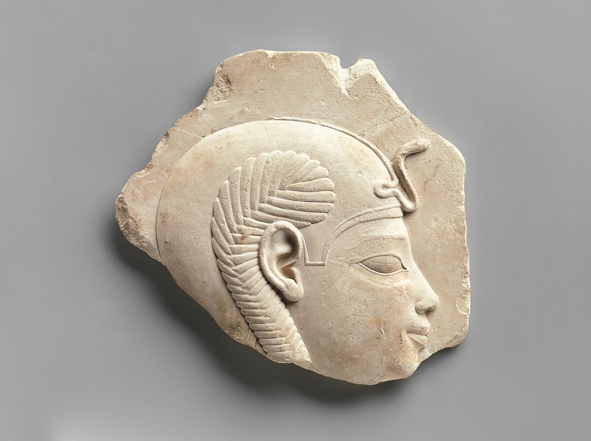 Relief head of a child god, Limestone 
