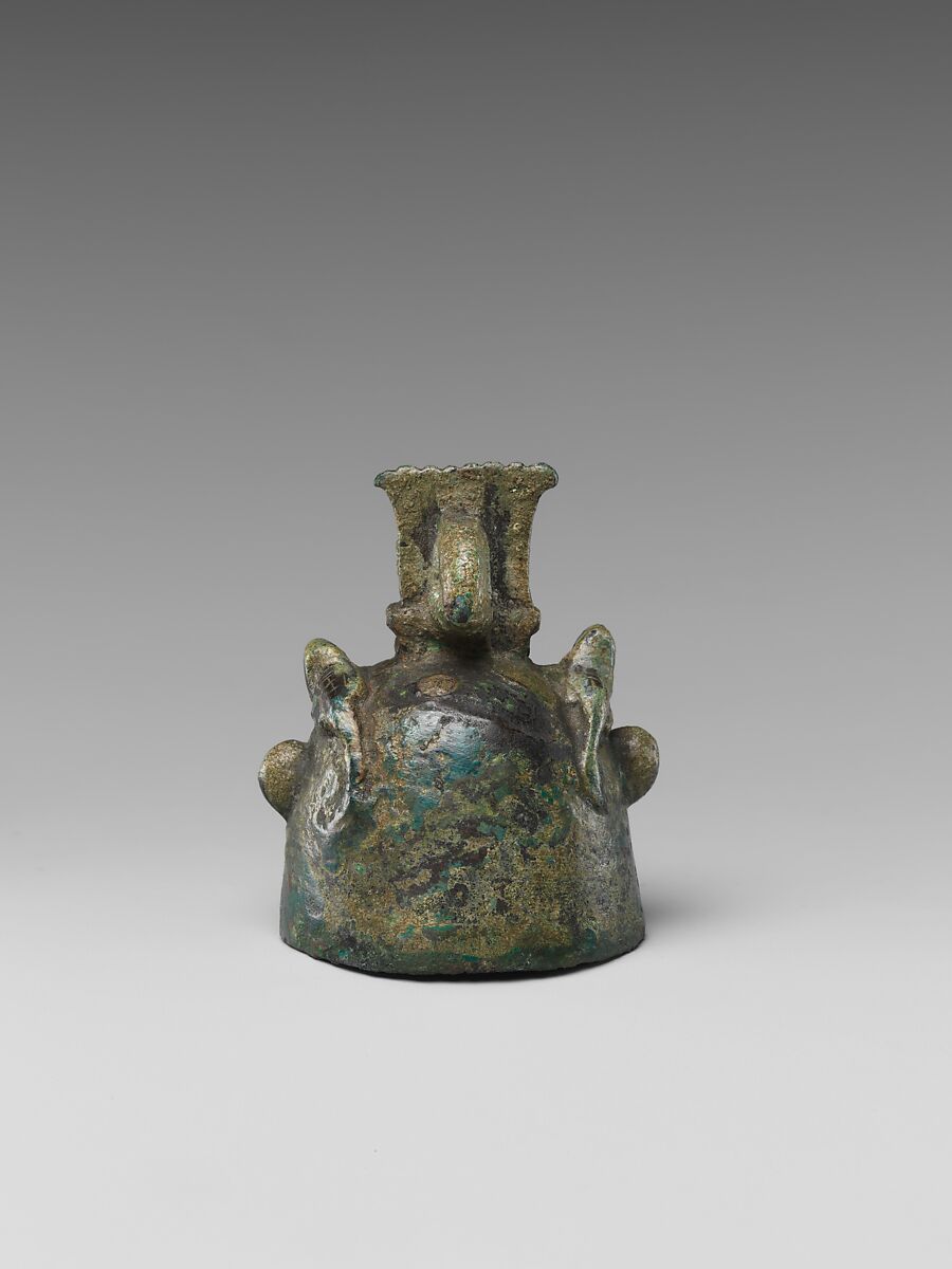 Bell in the form of Bes, cupreous metal