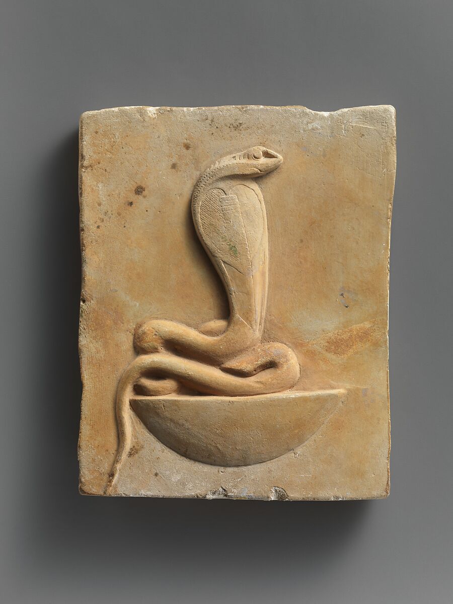 Relief plaque of cobra on a neb basket, Limestone 