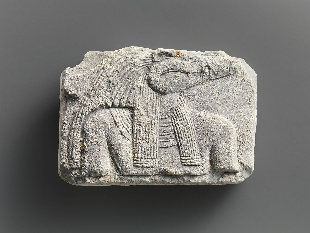 Relief plaque, upper part of crocodile-headed god, Limestone 