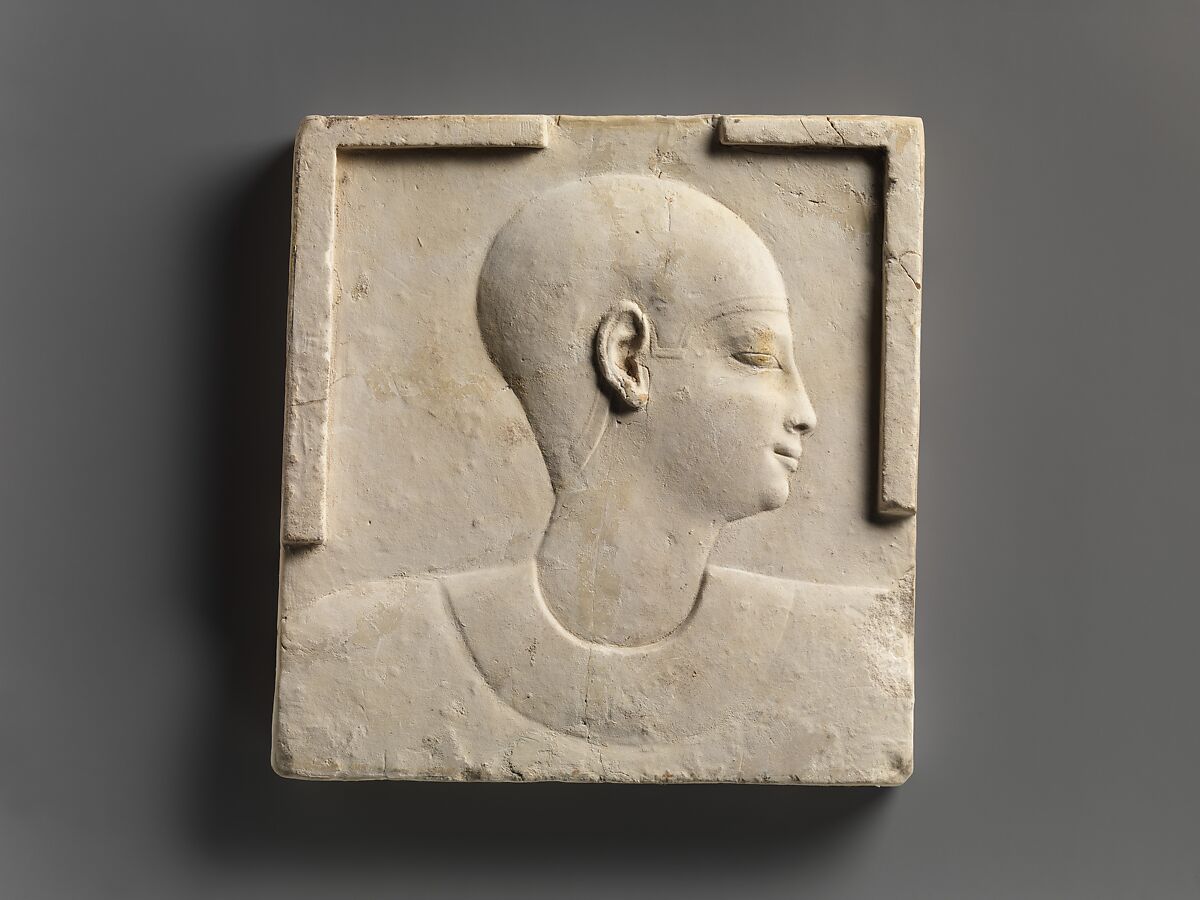 Plaque with head and shoulders of a priestly figure, opposite side head of priestly figure and most of a figure of crocodile-headed god, Limestone, paint 