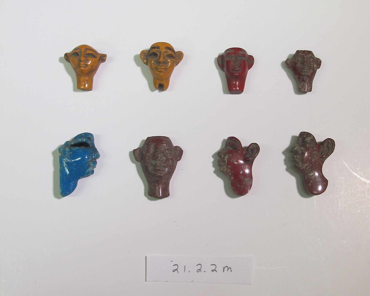 Inlays from shrine: heads, Glass 