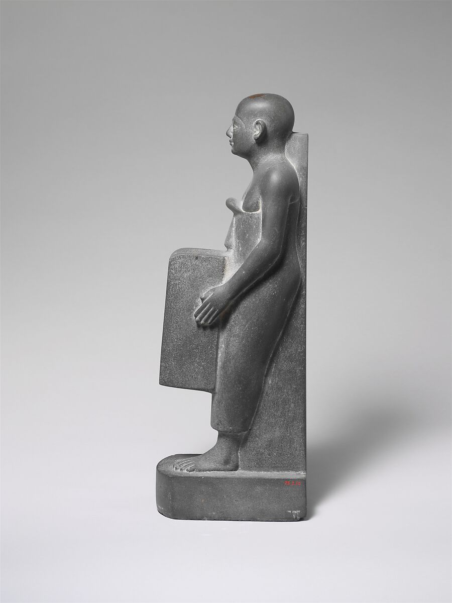 Man Holding a Shrine Containing an Image of Osiris, Greywacke