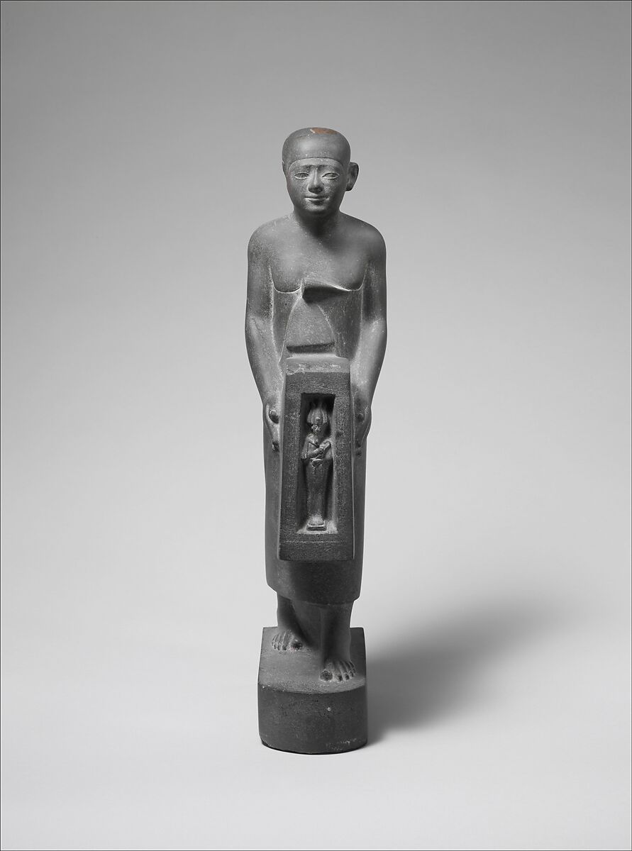 Man Holding a Shrine Containing an Image of Osiris, Greywacke