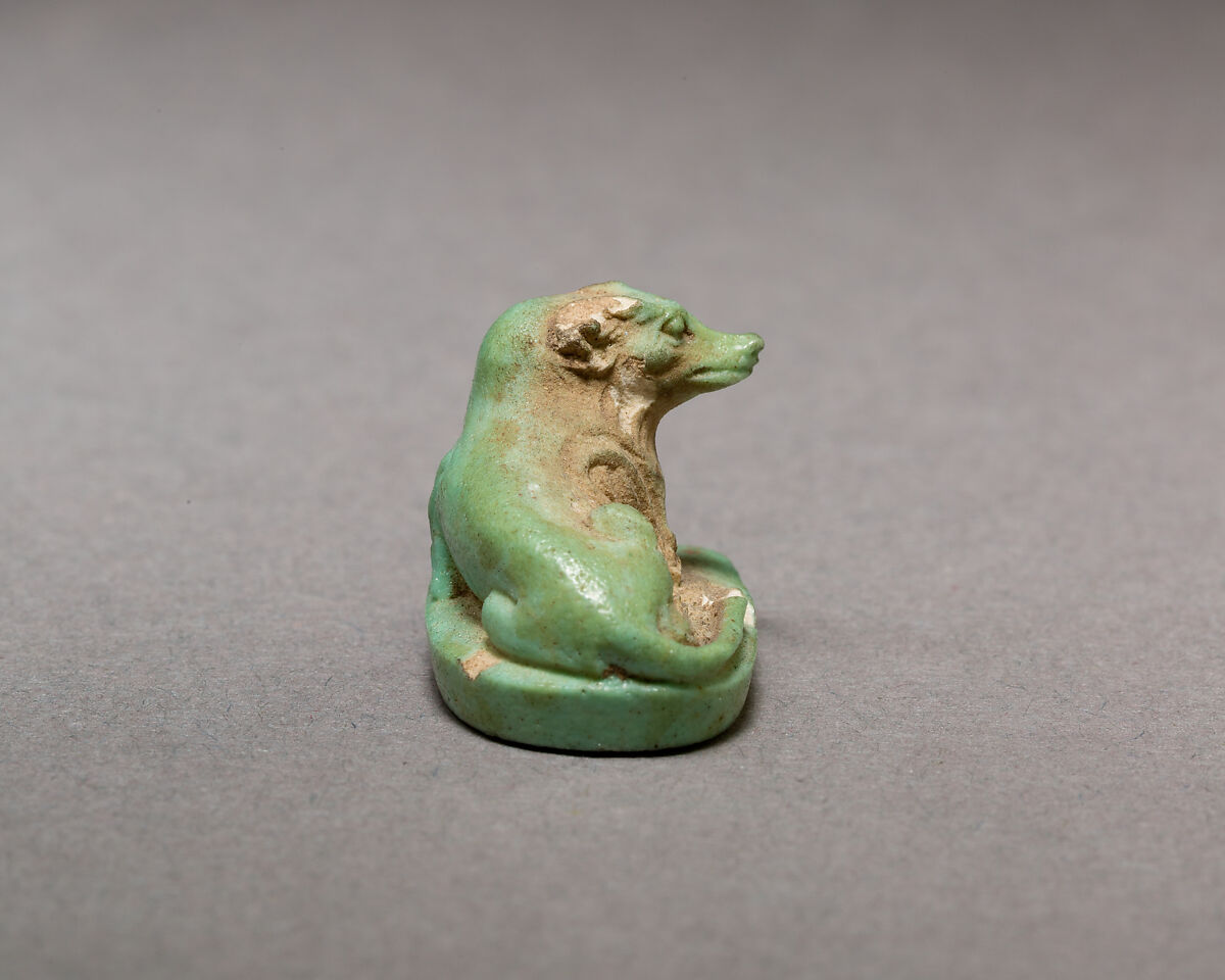 Reclining dog, Pale green faience