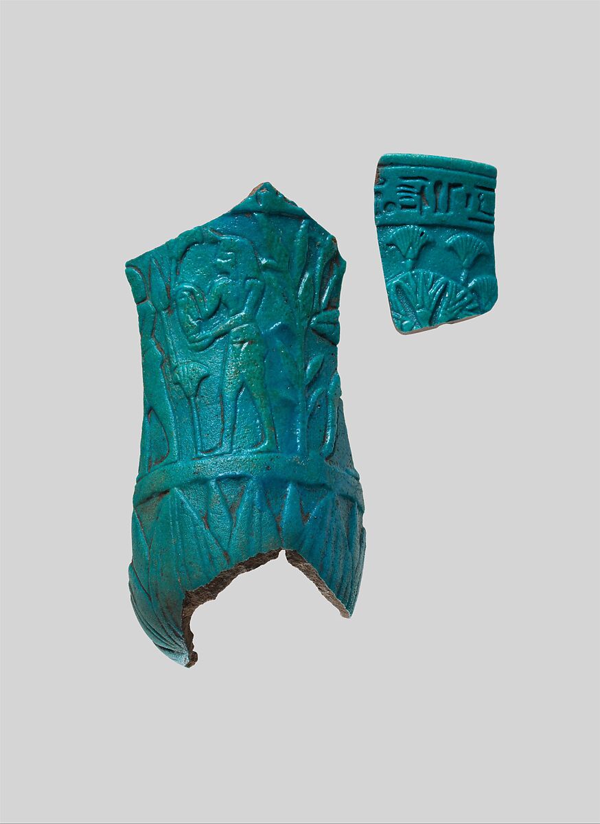 Rim fragment of relief chalice with inscription and papyrus plants, associated with 1983.599, Blue, green faience