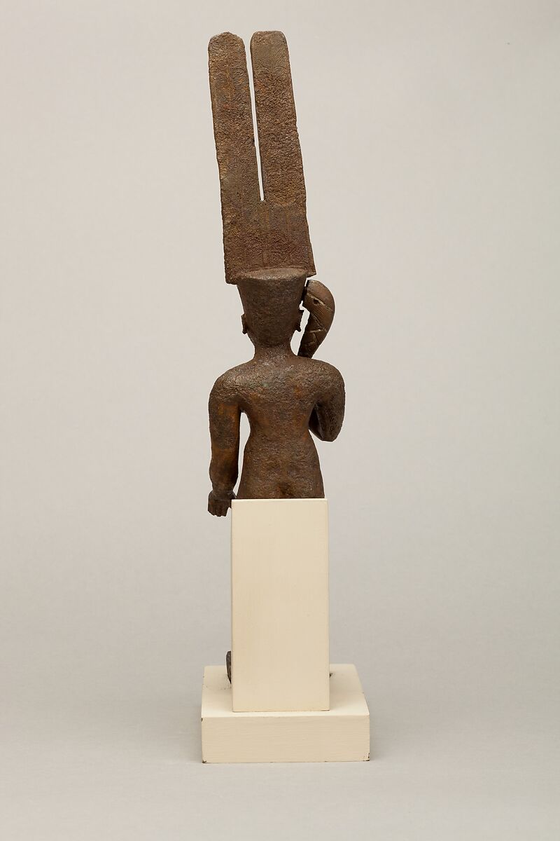 Seated Harpokrates with the crown of Amun, named as "Harpokrates-the-great, the eldest, the first of Amun", Cupreous metal, precious metal inlay