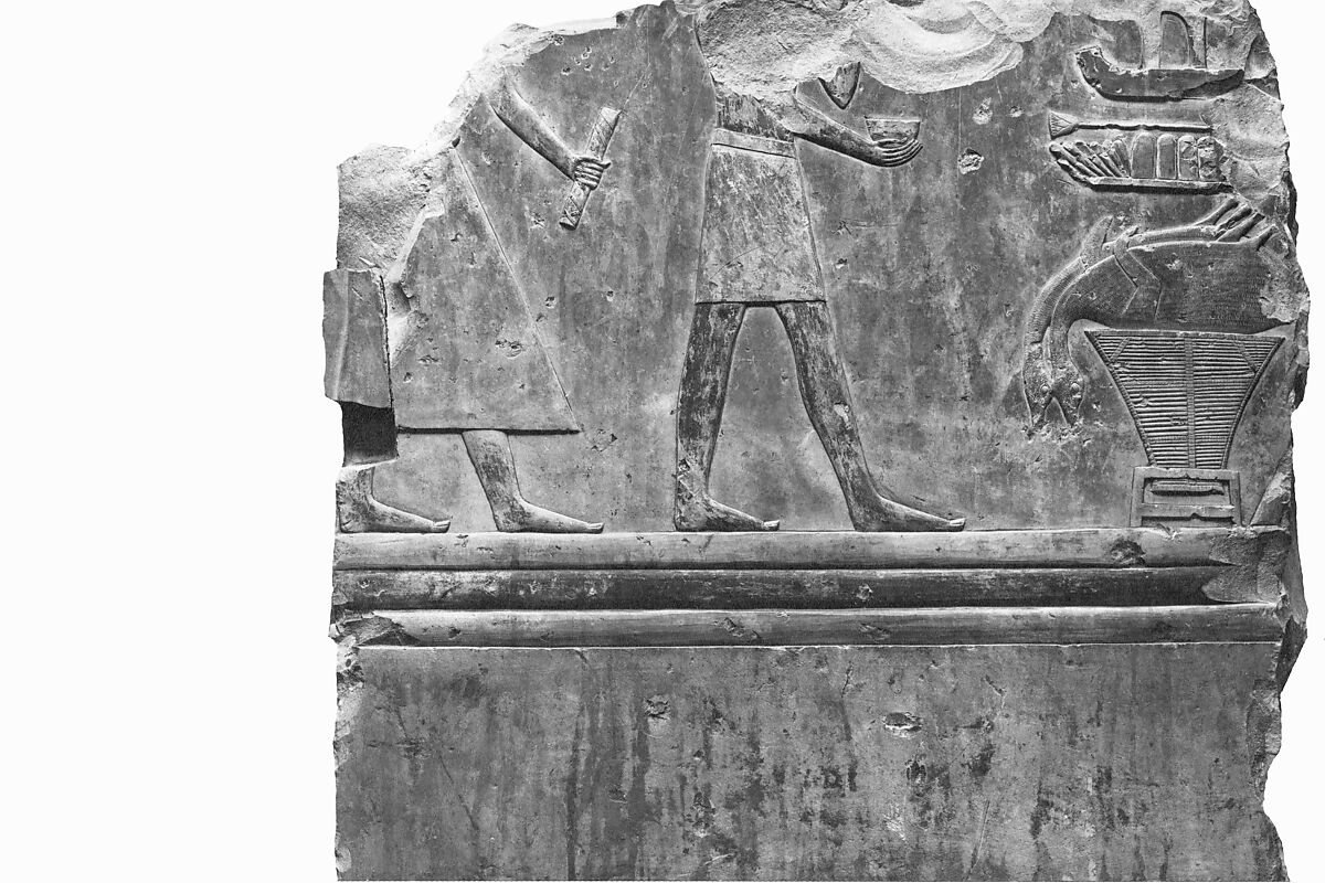 Relief from the tomb of Queen Neferu: a scribe and a cupbearer approach the queen's offering table, Limestone, paint