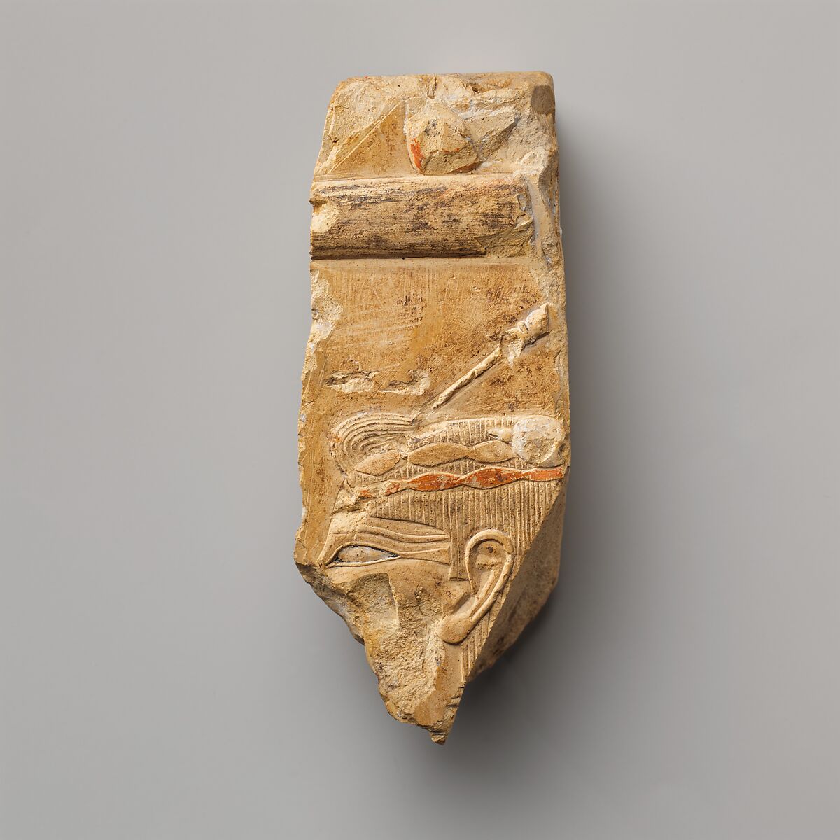 Relief of a woman with a hairpin - see 26.3.353-5, Limestone, paint 