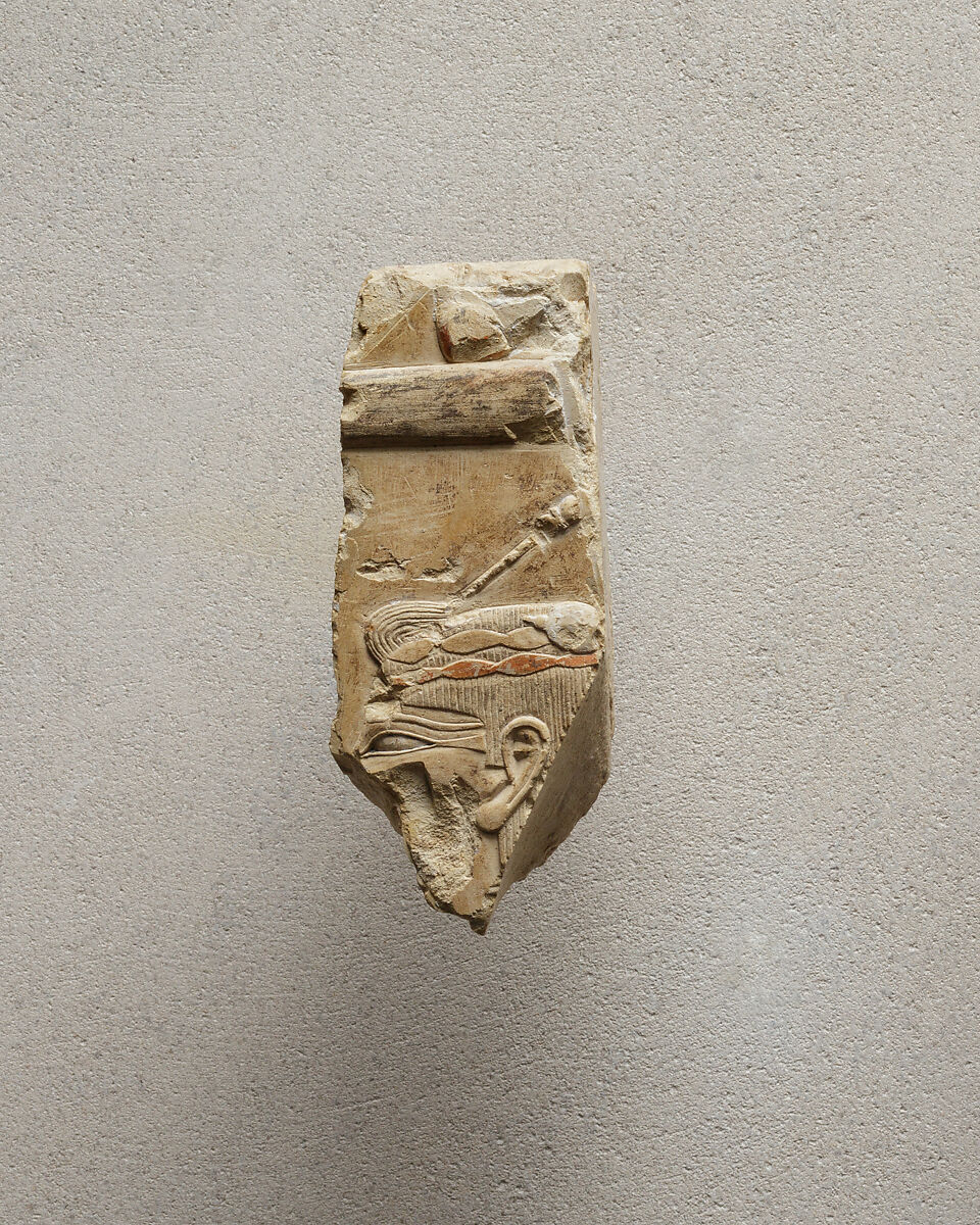 Relief of a woman with a hairpin - see 26.3.353-5, Limestone, paint