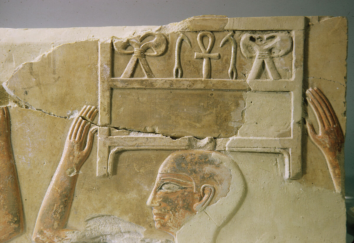 Relief of offering bearers carrying boxes, Limestone, paint