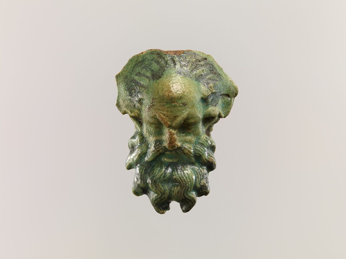 Head of a satyr for attachment to a jug, Faience 
