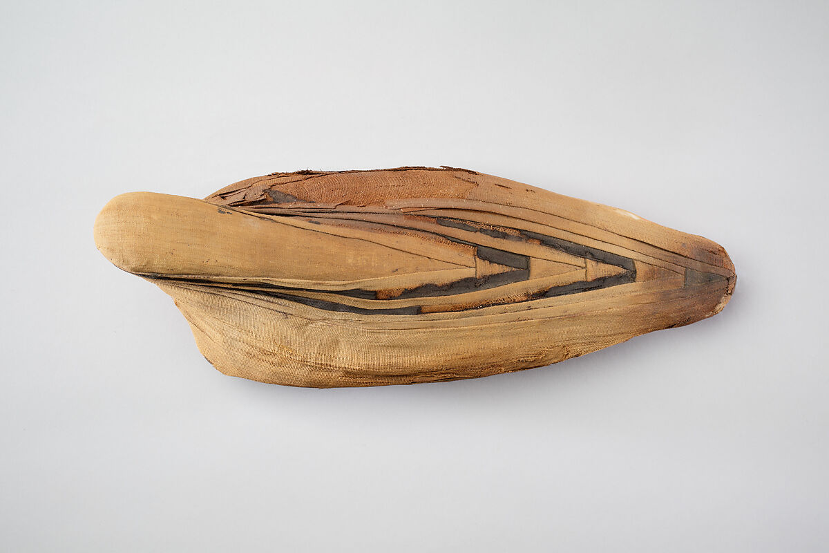 Sacred animal mummy of an ibis, Dyed and unyed linen, animal remains, mummfication materials