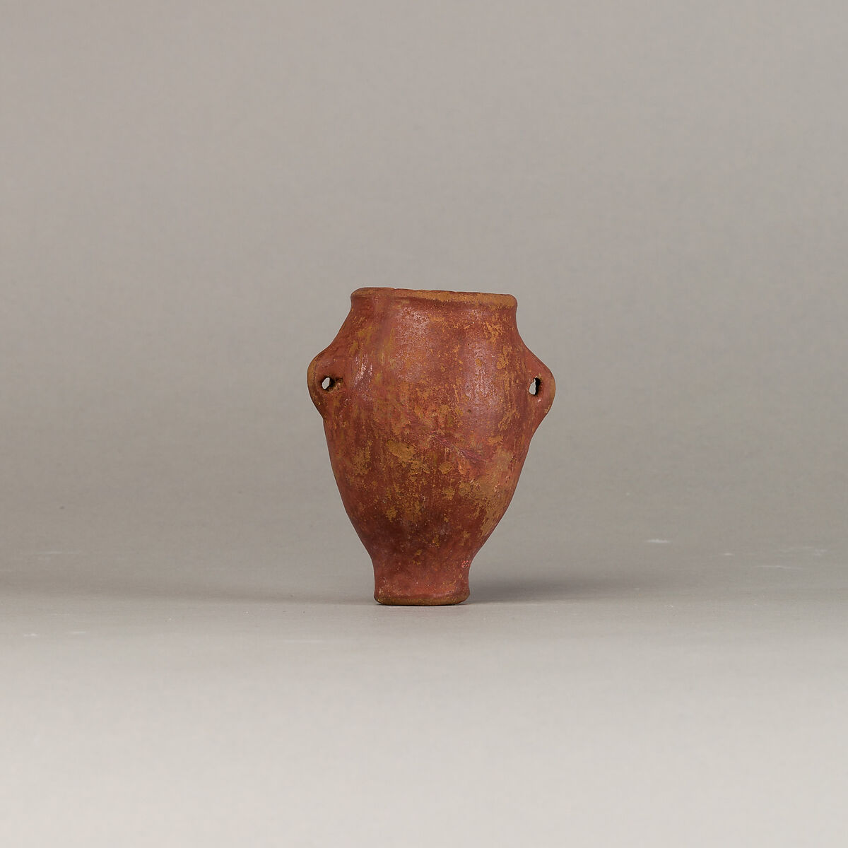 Polished red ware jar with lugs, Pottery