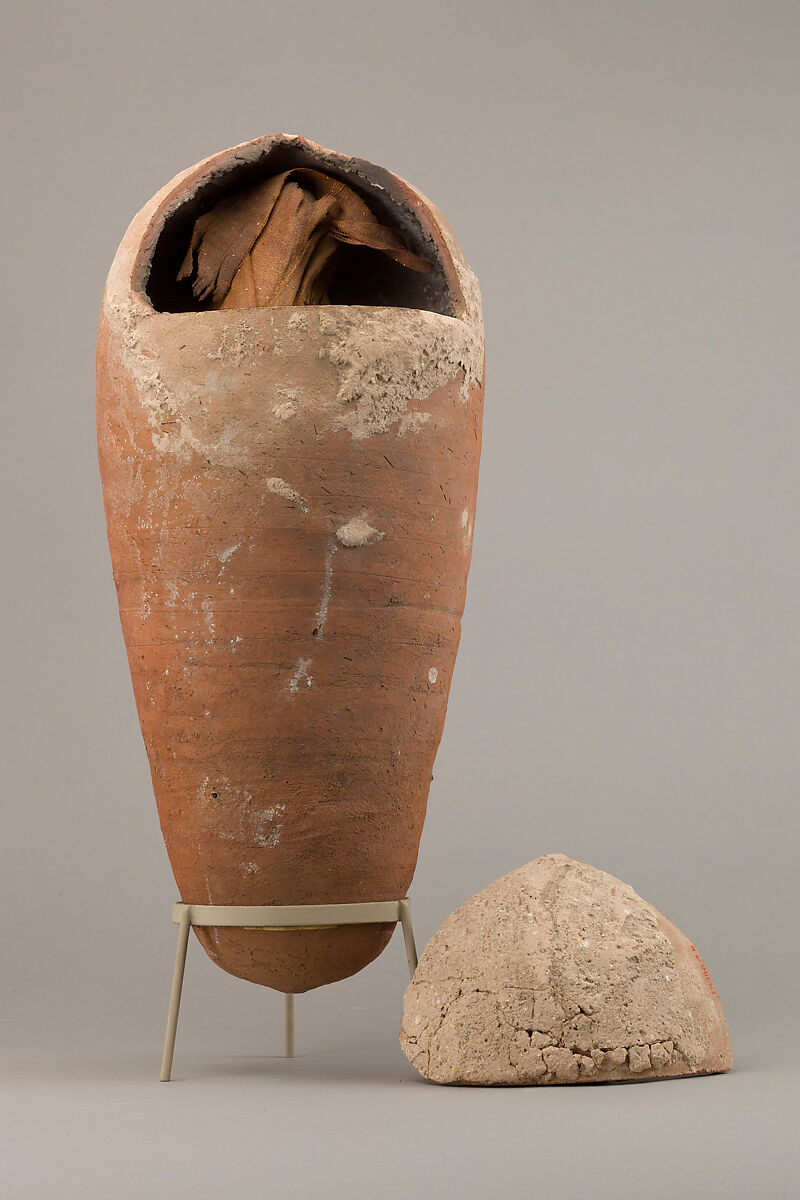 Sacred animal mummy of an ibis inside a jar, Pottery, linen, animal remains, mummification materials 