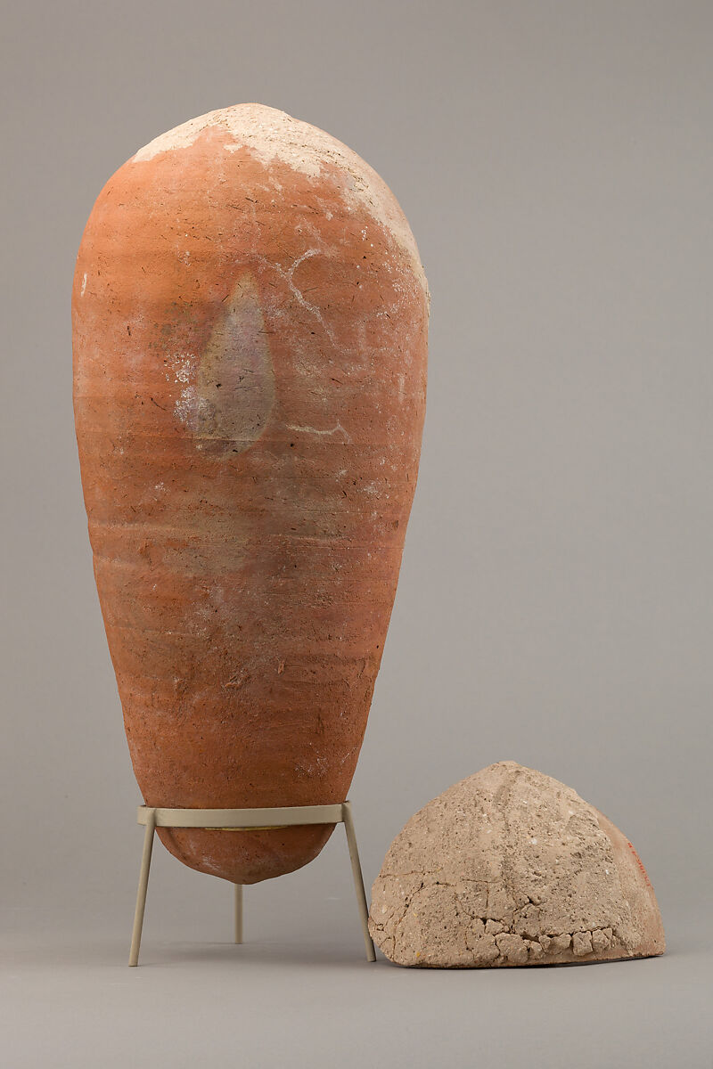 Sacred animal mummy of an ibis inside a jar, Pottery, linen, animal remains, mummification materials