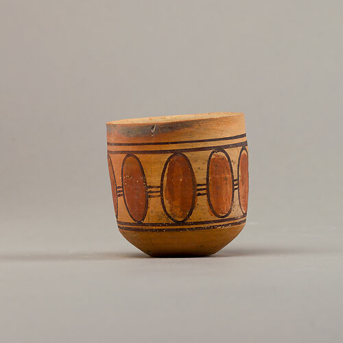 Cup with geometric decoration