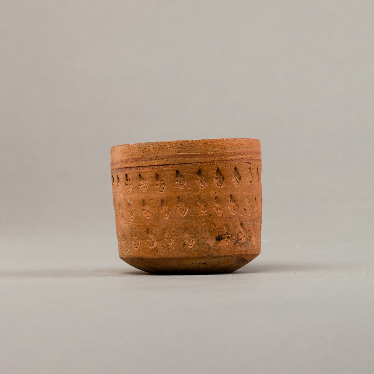 Cup with three rows of impressed decoration, Pottery, paint
