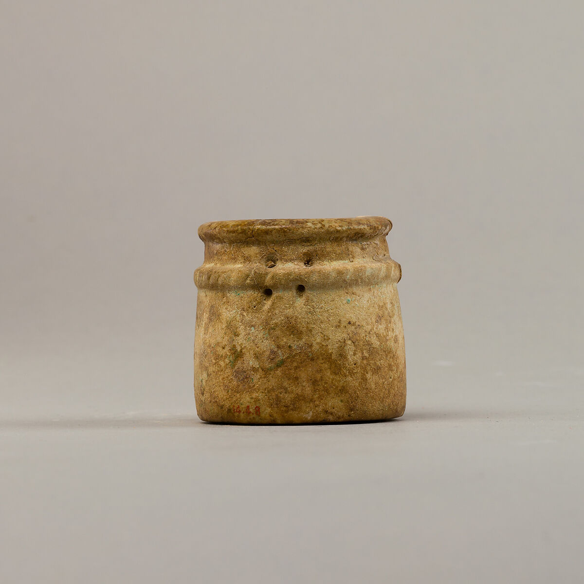 Small cylindrical jar with raised rope band, Faience 