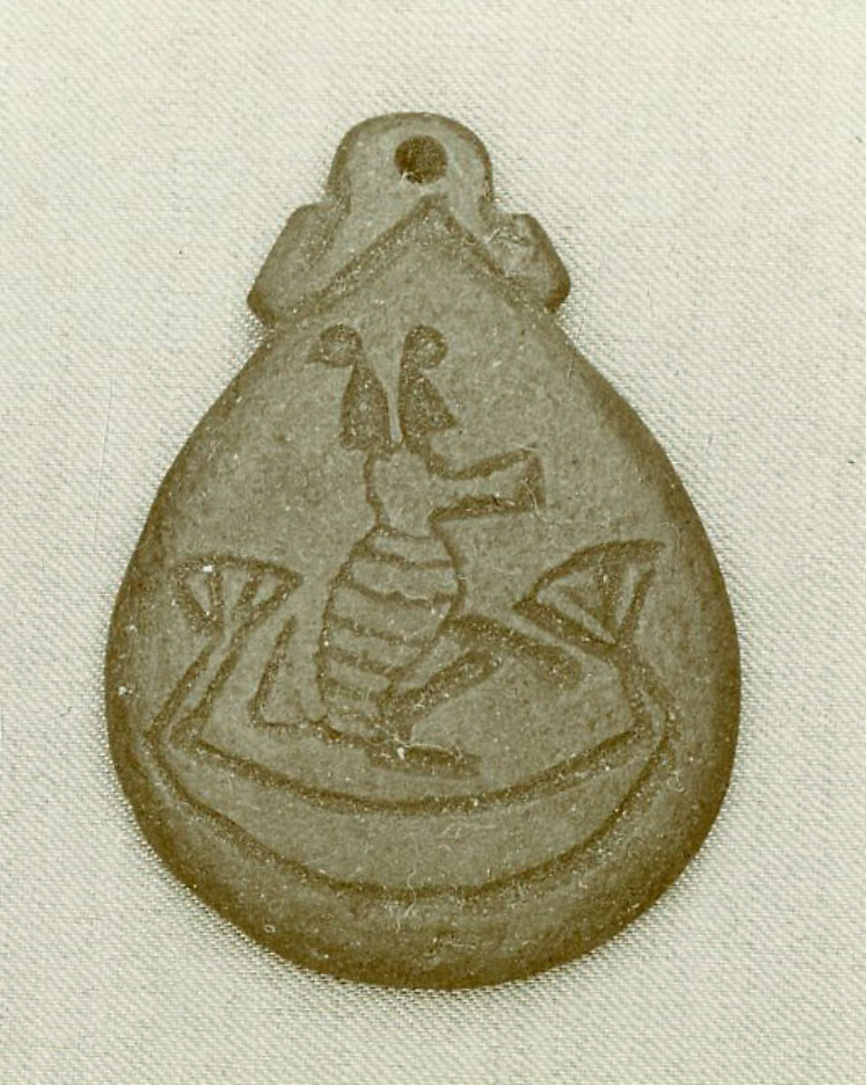 Amulet illustrating a baboon in a boat, Green faience