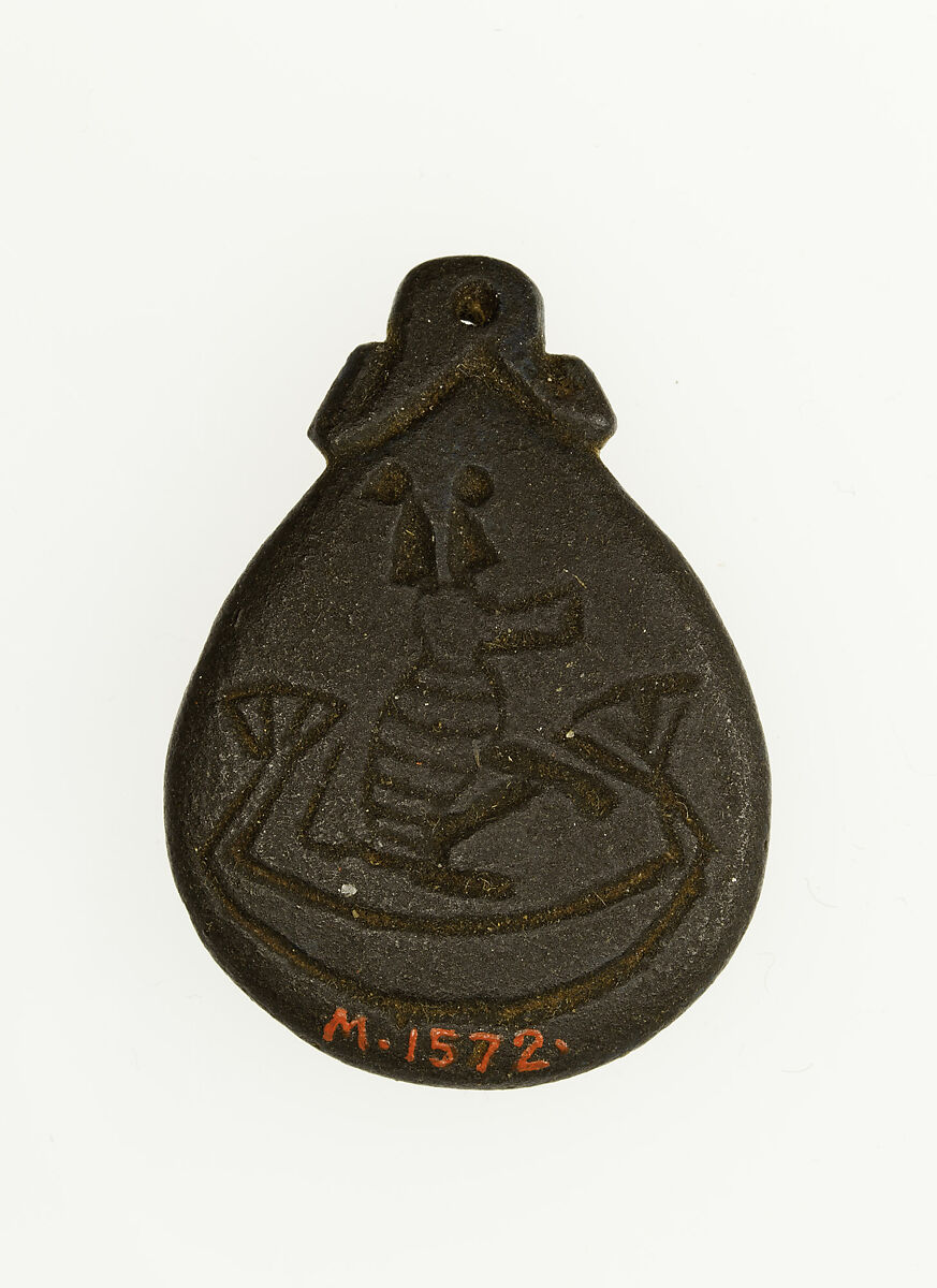 Amulet illustrating a baboon in a boat, Green faience 