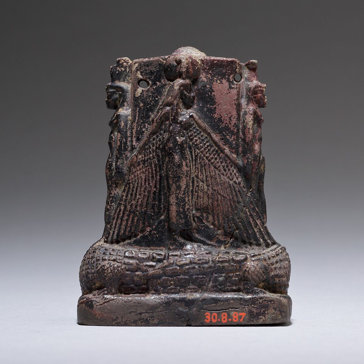 Cippus (magical stela) where Pataikos replaces Horus on the crocodiles and is flanked by Isis and Nephthys, Faience