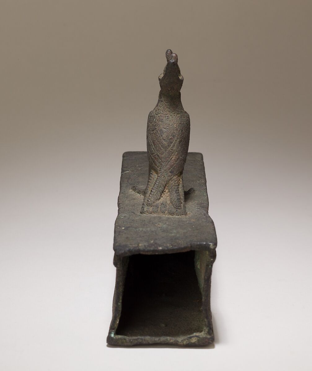 Case for an animal mummy topped by a falcon, Cupreous metal