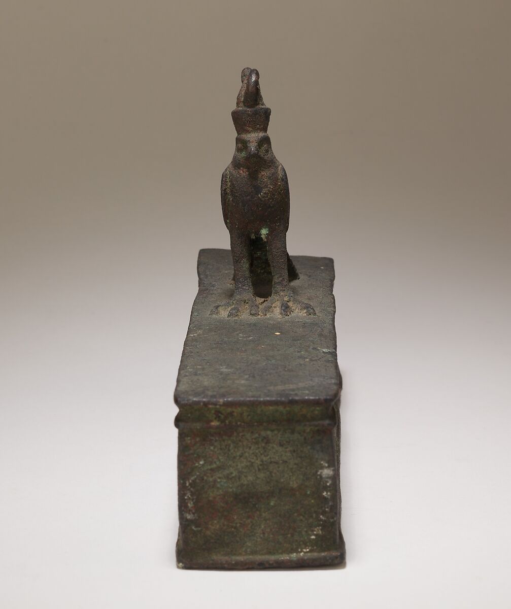 Case for an animal mummy topped by a falcon, Cupreous metal