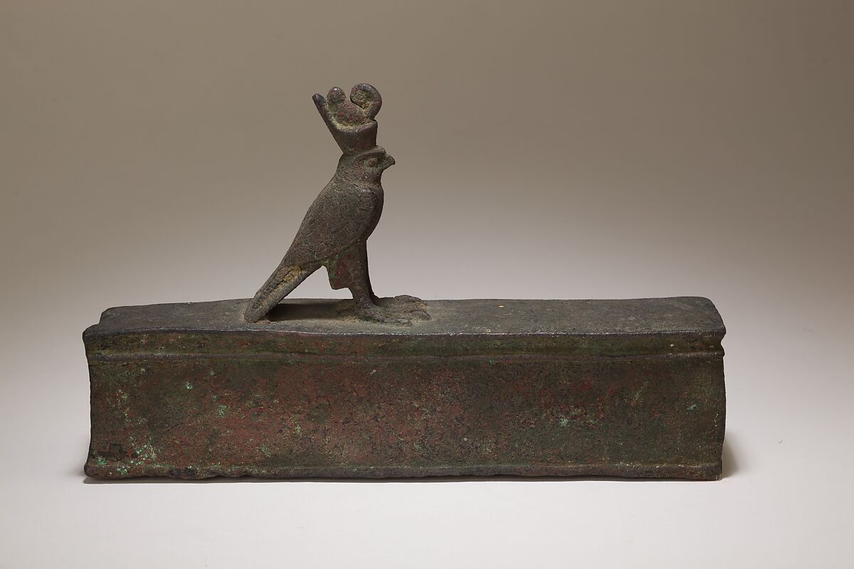 Case for an animal mummy topped by a falcon, Cupreous metal 