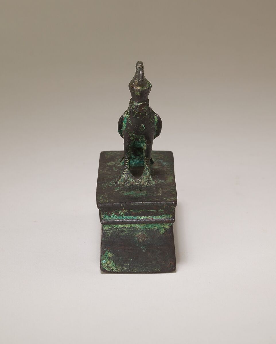 Falcon in double crown surmounting a shrine-shaped box for an animal mummy, Cupreous metal