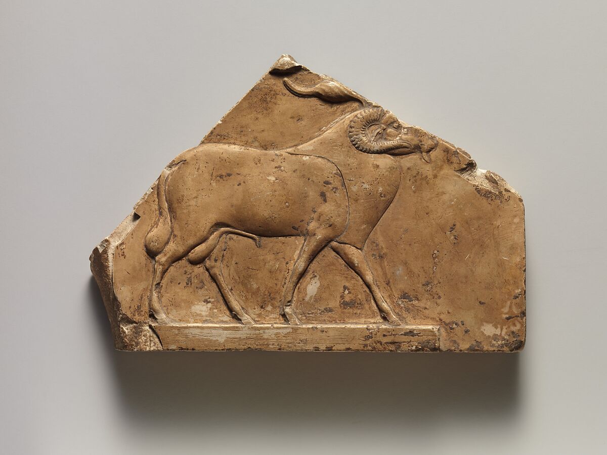 Relief plaque with ram, and on opposite side two feet, Limestone 