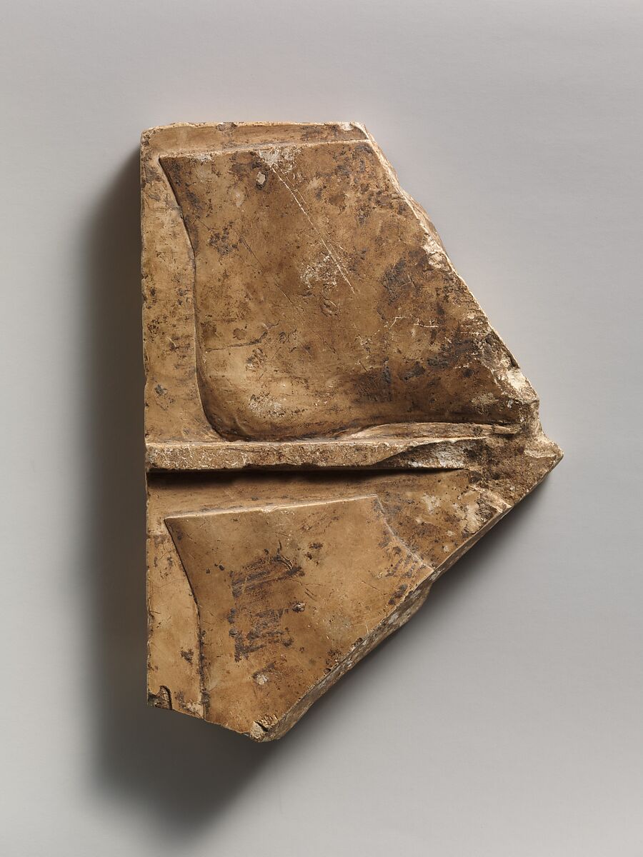 Relief plaque with ram, and on opposite side two feet, Limestone