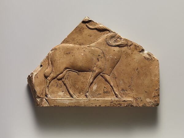 Relief plaque with ram, and on opposite side two feet