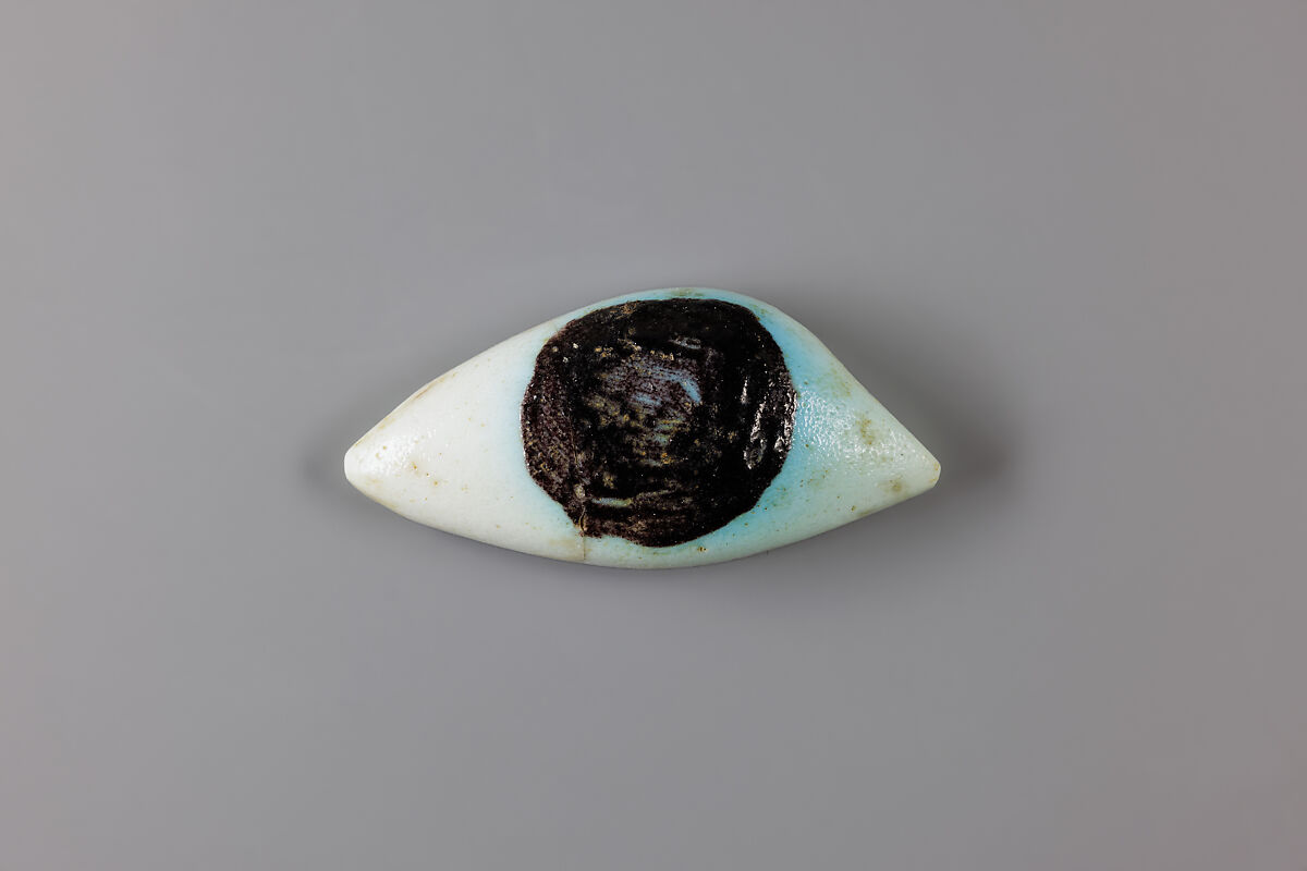 Eye inlay from coffin, Faience, black glaze 