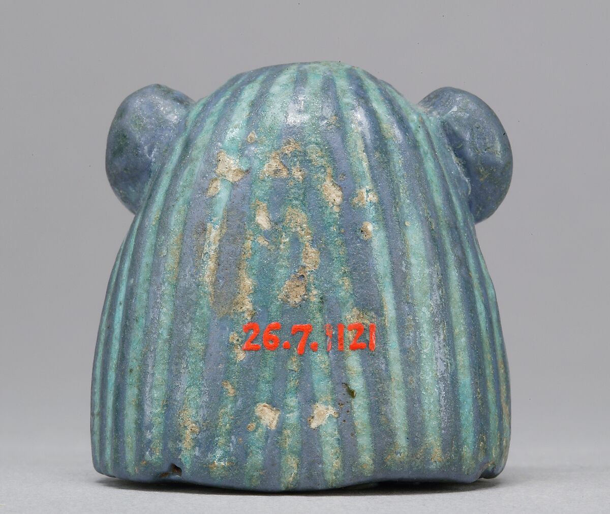 Bes-image as part of a mirror, Faience