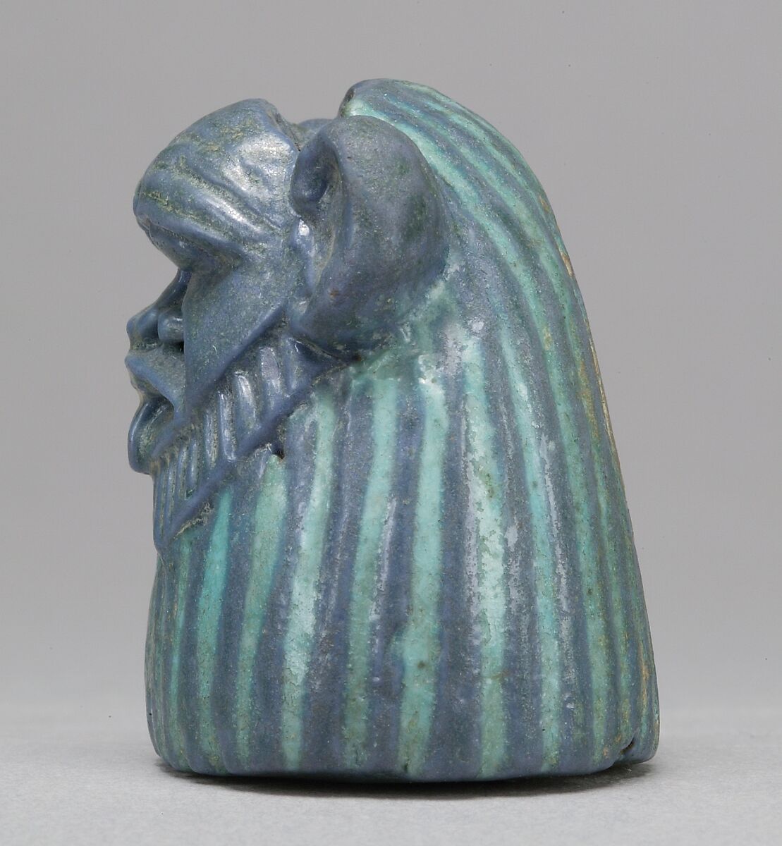 Bes-image as part of a mirror, Faience