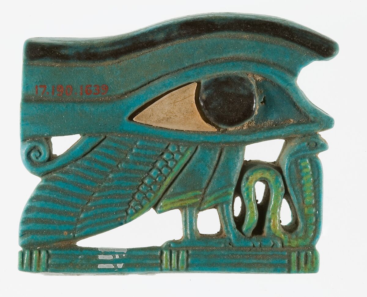 <em>Wedjat</em> eye amulet with a wing and other elements, Faience