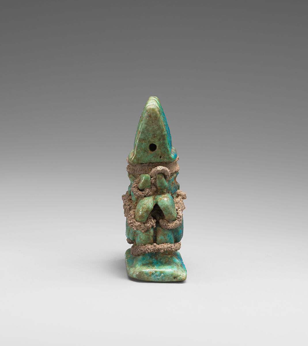 Amulet with twinned Bes-images, Green and blue faience, silver