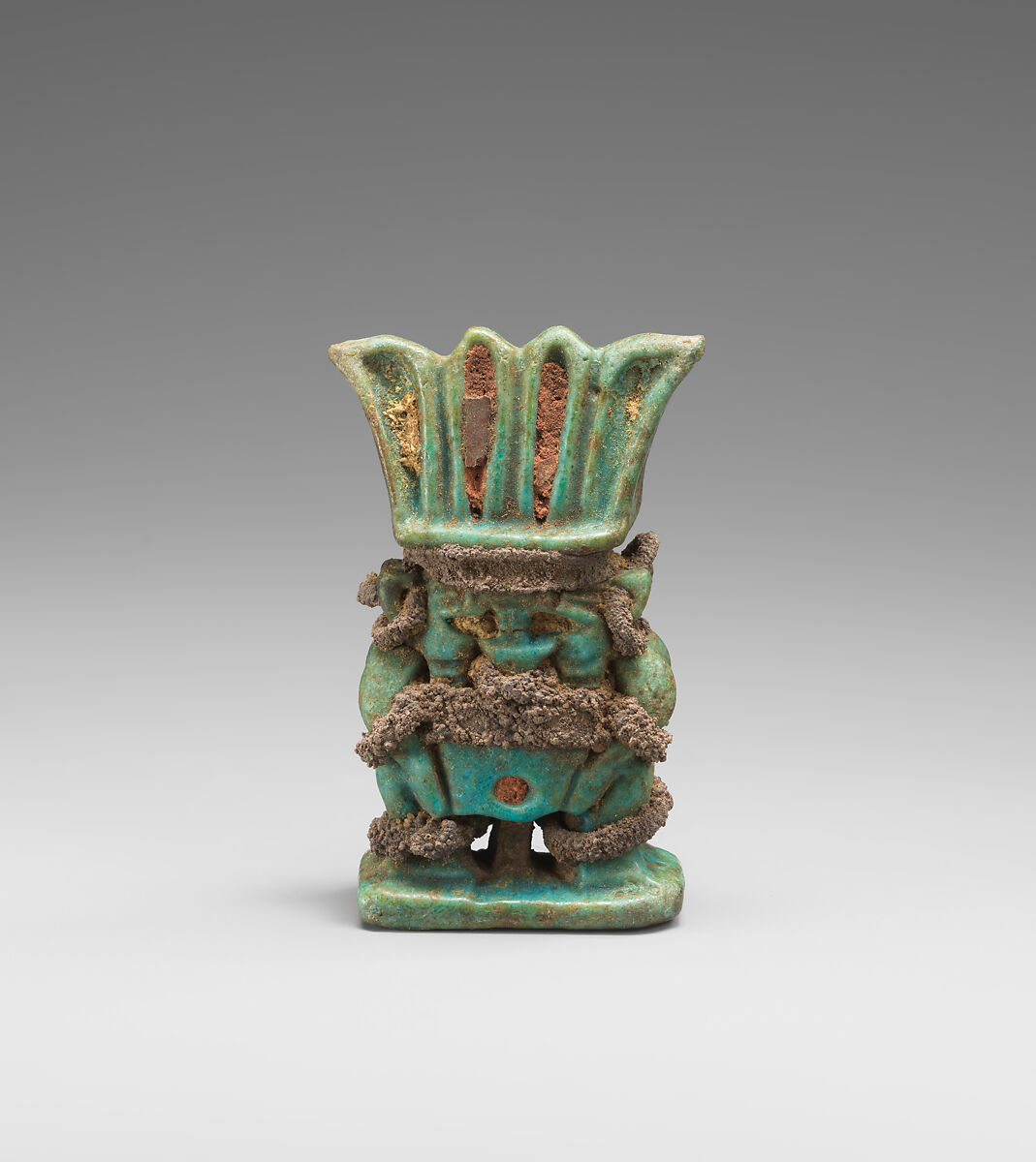 Amulet with twinned Bes-images, Green and blue faience, silver